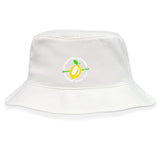 The EMB S&S Activewear Littleton Women Rugby Club Crusher Bucket Cap is a white cotton twill hat with a yellow lemon graphic and “LITTLETON LEMONS WOMEN'S RUGBY CLUB” text, combining stylish sun protection with team spirit.