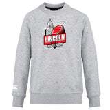 The Lincoln City Youth Rugby Club Crew Sweatshirt by Canterbury features a chest logo with a rugby ball and building, plus an embroidered Canterbury logo on the left sleeve. Brand: WRS Canterbury.