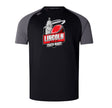 The Lincoln City Youth Rugby Elite Training Tee by WRS Canterbury features black and gray colors, a bold red rugby ball graphic, lightweight durable Vapodri fabric, and the "Lincoln City Youth Rugby" logo on the front.