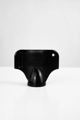 The Starlai Corp WRS M6 Stud Wrench is a black plastic tool with a flat top, rounded edges, a hole in the upper right corner, and a conical base—perfect for use with M6 studs. Shown against a white background.