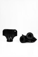 Two black Starlai Corp WRS M6 Stud Wrench tools rest on a white surface—one upright showing a flat top with a hole, and the other lying down, exposing its cylindrical M6 stud components.