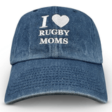 The Modish Rugger I Heart Rugby Moms Cap, by Modish Rugger, is a blue denim baseball hat with "I ♥ RUGBY MOMS" embroidered in white. Its comfortable fit makes it perfect for stylishly displaying your passion.