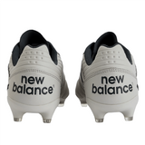 Rear view of a pair of New Balance Wide 442 V2 Pro FG soccer cleats in Concrete, Grey Matter, and Blacktop with black logos and firm ground studs, crafted from premium leather for rugby.
