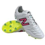 A pair of New Balance 442 v2 Pro Synthetic FG soccer cleats in White/Hi Lite/Neon Pink, featuring neon pink "N" logos, neon green soles, and premium microfiber uppers, arranged with one shoe standing upright and the other propped against it.