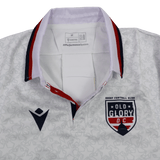 Show your team pride with the Old Glory DC MLR 25/26 Replica Away Jersey by Macron, featuring a patterned white design, team and Macron logos on the chest, and a stylish white, red, and navy collar—ideal for any fan.