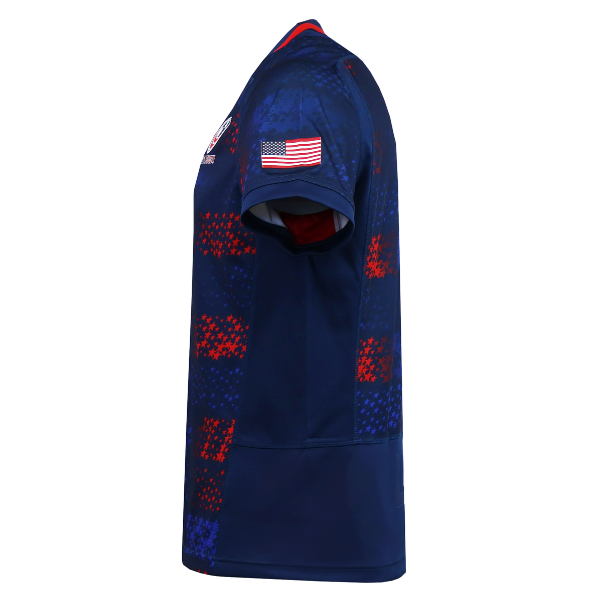 The USA Rugby 25/26 Away Replica Jersey by Macron features red and blue checkered patterns, a USA flag patch on the sleeve, and is shown from a side view. This patriotic Macron jersey is perfect for showing your team spirit.