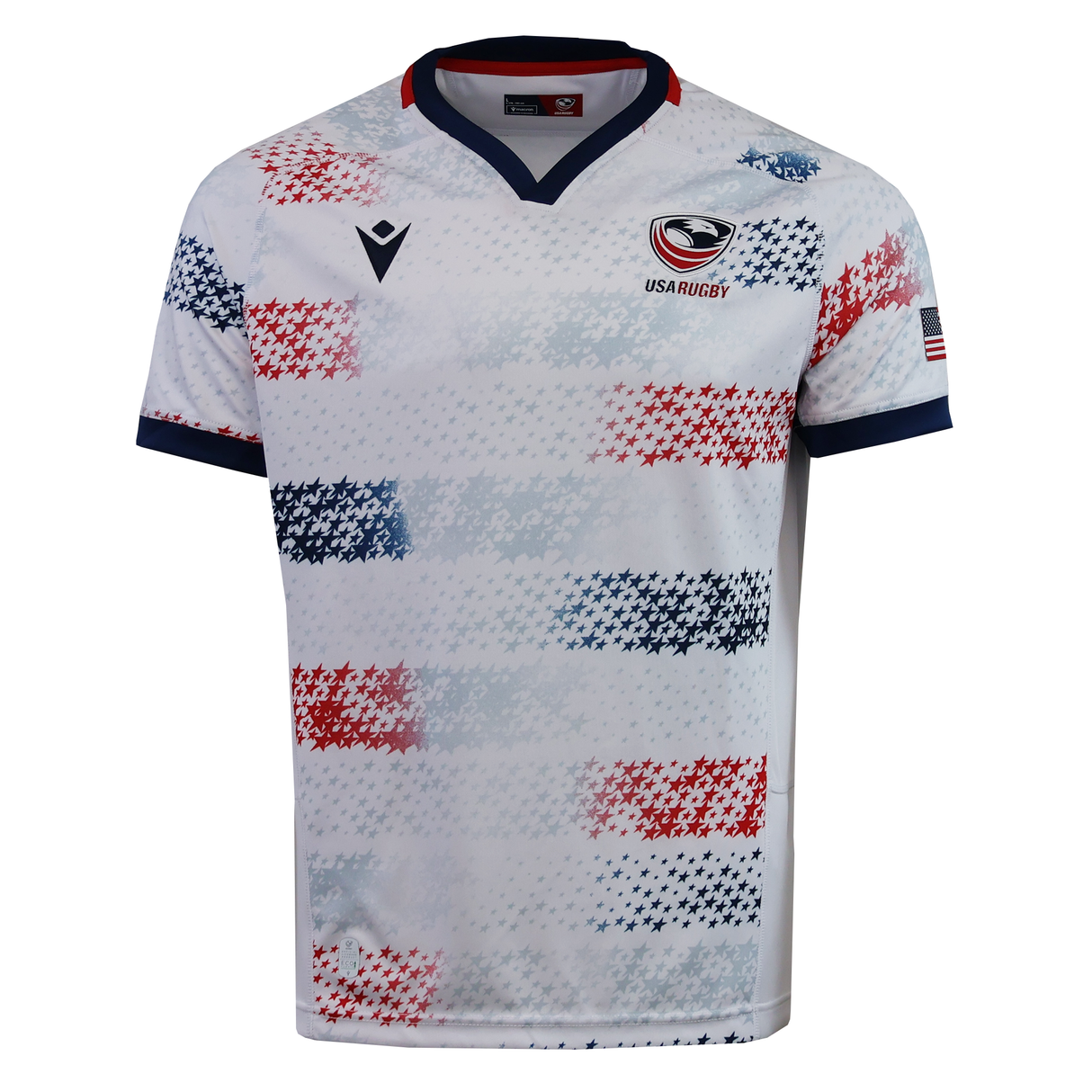 Show your pride in the USA Rugby 25/26 Home Replica Jersey by Macron, featuring blue and red pixelated star patterns, navy collar and cuffs, USA Rugby chest logo, and an American flag on the sleeve.