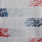 The USA Rugby 25/26 Home Replica Jersey by Macron features small red, white, and blue stars in horizontal stripes on a white background, inspired by classic USA Rugby jersey style.
