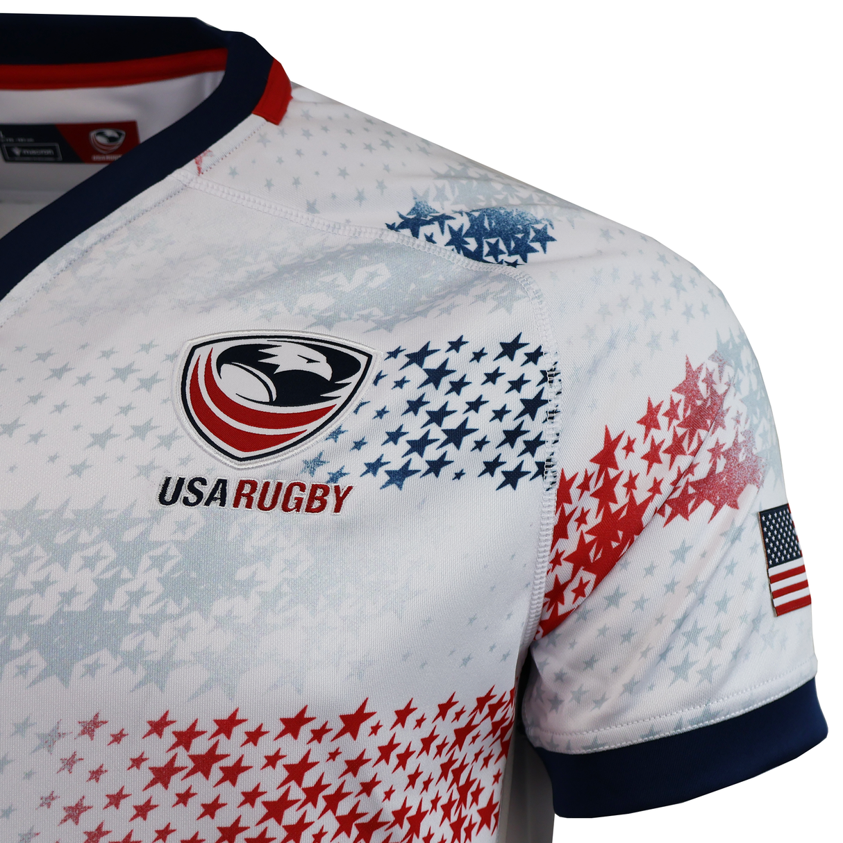 Close-up of the USA Rugby 25/26 Home Replica Jersey by Macron, featuring the official logo, red and blue stars, and an American flag patch on the sleeve—an authentic choice for any USA Rugby fan.