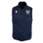 The USA Rugby 25/26 Padded Gilet by Macron is a navy blue, lightweight gilet with a high collar, featuring the USA Rugby logo on the left chest and a white Macron logo on the right.