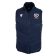 The USA Rugby 25/26 Padded Gilet by Macron is a navy blue, lightweight gilet with a high collar, featuring the USA Rugby logo on the left chest and a white Macron logo on the right.