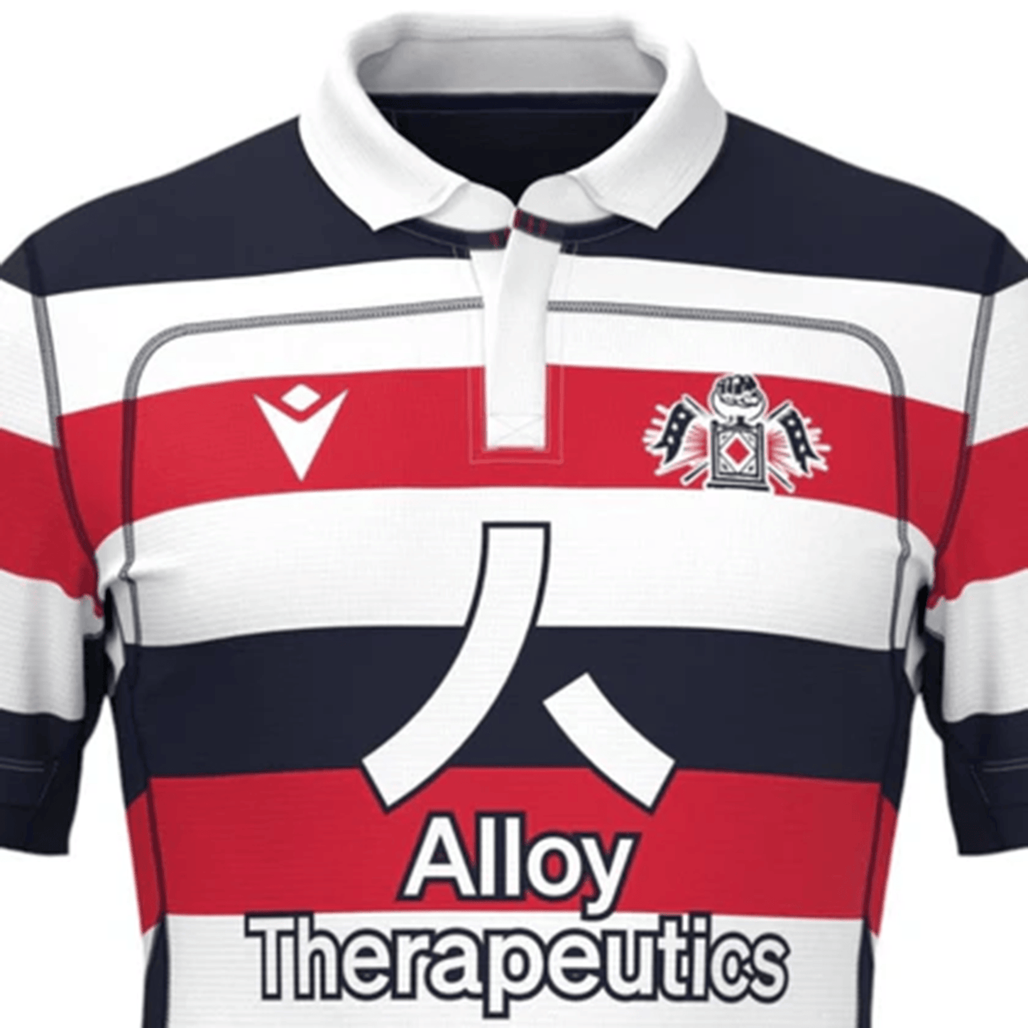 The New England Free Jacks MLR 25/26 Replica Home Jersey by Macron features bold red, white, and navy stripes, a team crest, Macron logo, and Alloy Therapeutics sponsor—perfect for fans to show their support in style.