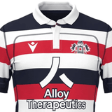 The New England Free Jacks MLR 25/26 Replica Home Jersey by Macron features bold red, white, and navy stripes, a team crest, Macron logo, and Alloy Therapeutics sponsor—perfect for fans to show their support in style.