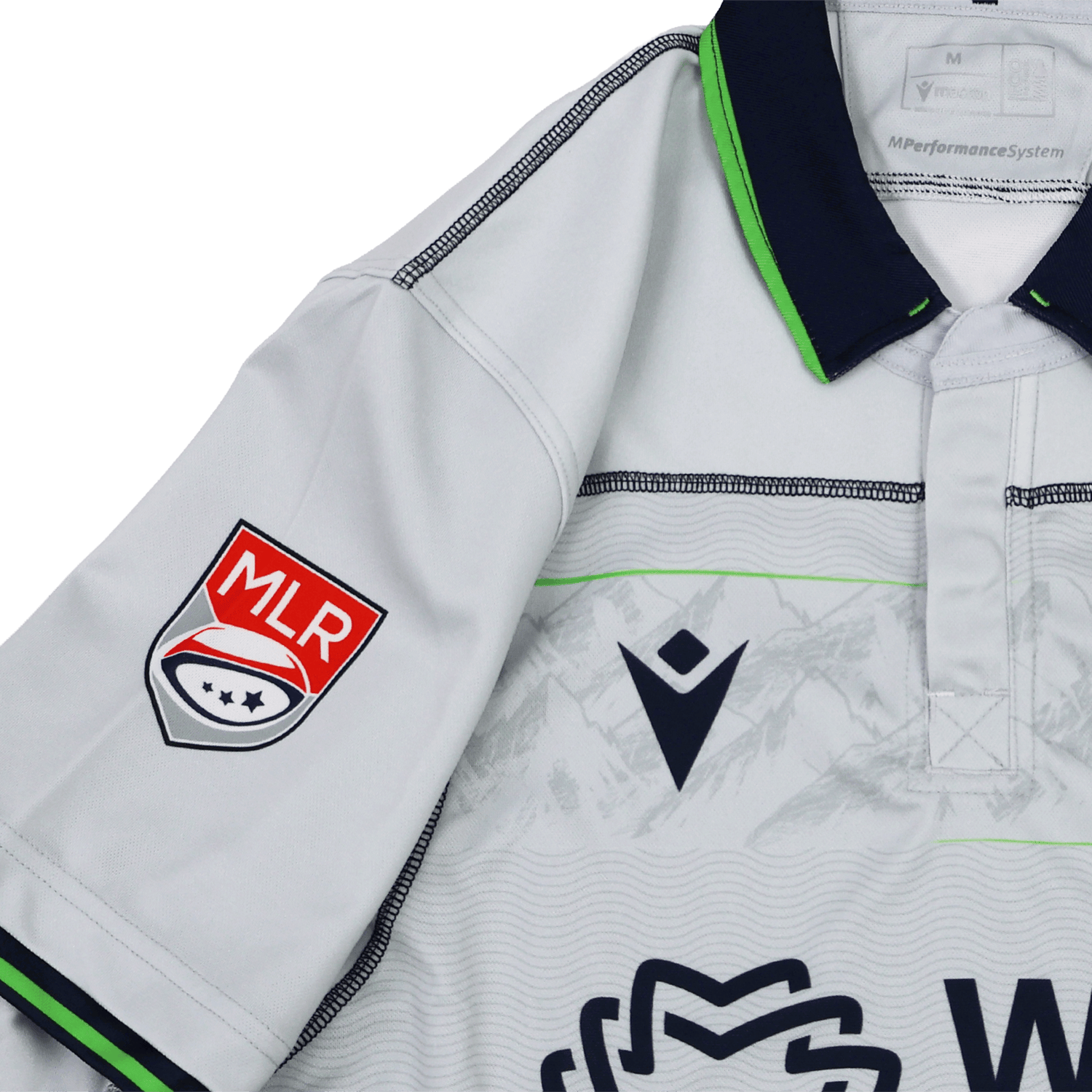 The Seattle Seawolves MLR 25/26 Replica Away Jersey by Macron features white fabric with dark blue and neon green trim, a Macron logo on the chest, and an MLR patch on the sleeve.