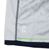 Close-up of the Seattle Seawolves MLR 25/26 Replica Away Jersey by Macron, featuring white fabric with gray patterns, dark blue stitching, a green stripe, and an ECO4 label near the bottom hem—showcasing authentic Macron quality.
