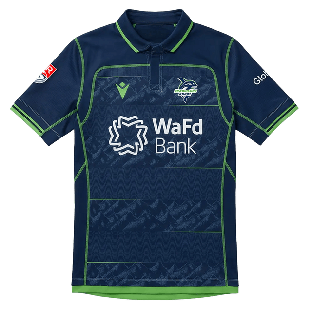 The Seattle Seawolves MLR 25/26 Replica Home Jersey by Macron features navy blue and green colors, the team logo, WaFd Bank sponsor on the front, and additional sponsor logos on the sleeves.