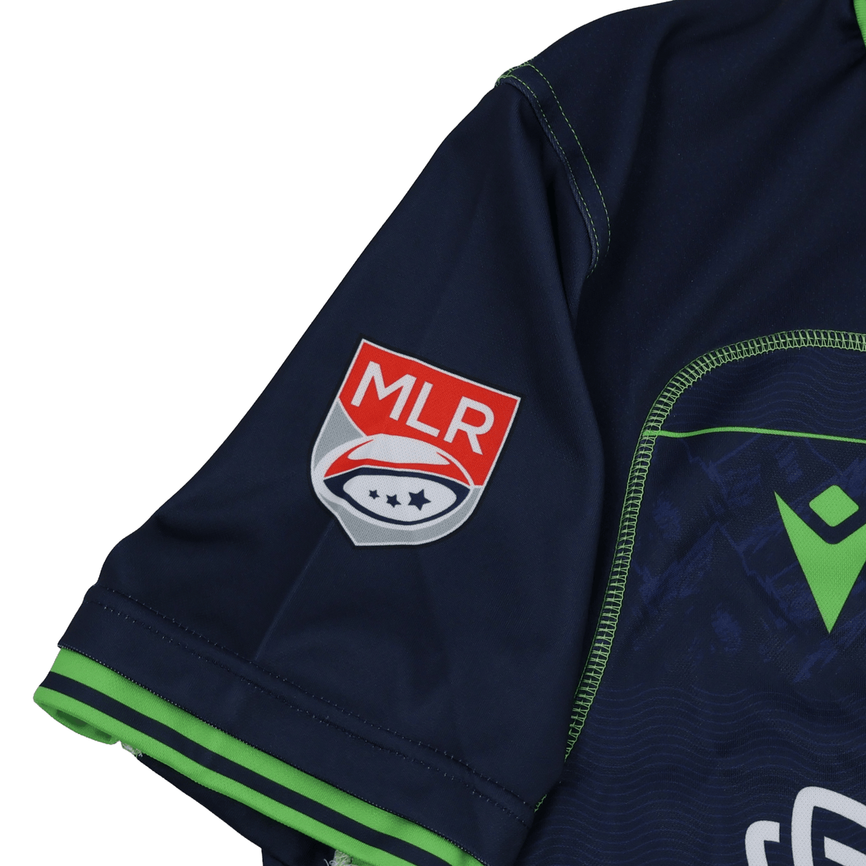 Close-up of the Seattle Seawolves MLR 25/26 Replica Home Jersey by Macron, featuring a navy sleeve with red and white Major League Rugby logo patch and green cuff trim.