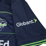 The Seattle Seawolves MLR 25/26 Replica Home Jersey by Macron features navy blue fabric, the Globant logo in white and green, a shark graphic, and "Wolves Rugby" text—a classic MLR home jersey from Macron.