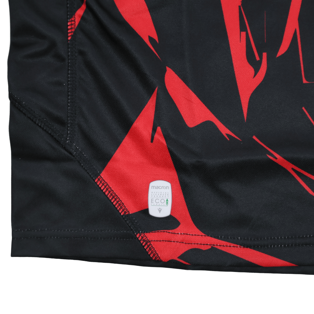 Close-up of the Utah Warriors MLR 25/26 Replica Home Jersey by Macron, featuring a "macron eco" label sewn into the seam—a sustainable touch on this official Major League Rugby apparel.
