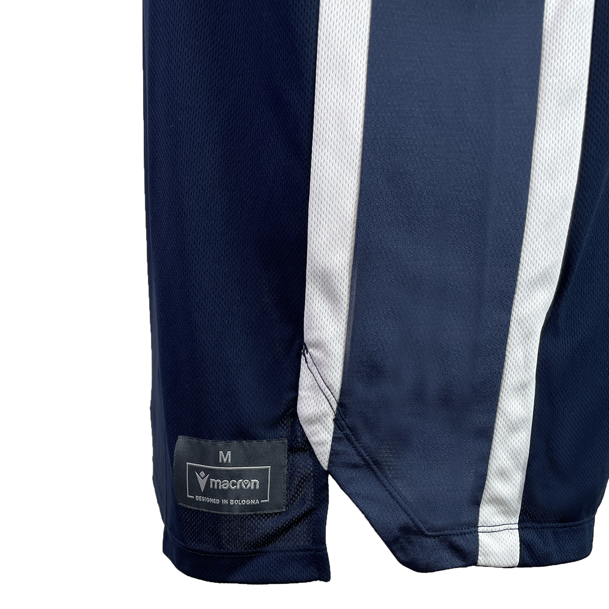 Close-up of the lower part of the USA Rugby 25 Basketball Singlet by Macron in navy blue with white stripes and a visible Macron size M label, inspired by USA Rugby style.