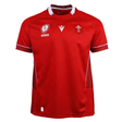 Show your support for Welsh rugby with the Wales WRWC25 Replica Home Jersey by Macron—a red short-sleeve jersey featuring white trim, chest logo patches, and a stylish pattern, perfect for fans ahead of the Women’s Rugby World Cup 2025.