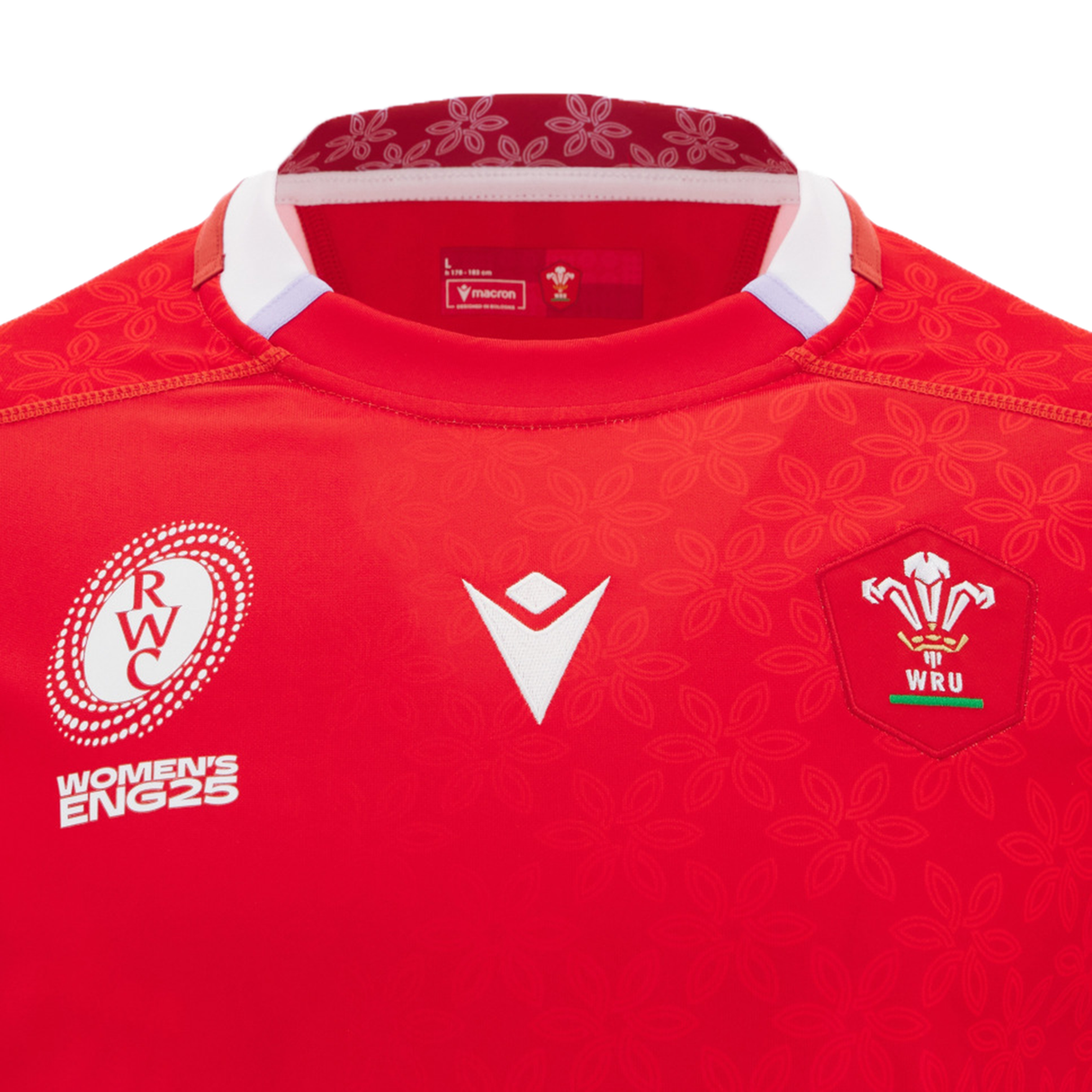 Close-up of the Wales WRWC25 Replica Home Jersey by Macron, showcasing the WRU logo, Rugby World Cup 2025 emblem, and a floral collar—ideal for Welsh rugby fans ahead of the Women’s Rugby World Cup.
