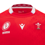 Close-up of the Wales WRWC25 Replica Home Jersey by Macron, showcasing the WRU logo, Rugby World Cup 2025 emblem, and a floral collar—ideal for Welsh rugby fans ahead of the Women’s Rugby World Cup.
