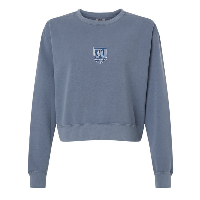 The EMB S&S Activewear Minneapolis Mayhem Rugby Women’s Garment-Dyed Mid-Length Crewneck Sweatshirt features a blue heavyweight fleece construction for warmth and comfort. Designed with long sleeves and a small white crest logo on the chest, this garment-dyed sweatshirt delivers a soft, lived-in feel that’s perfect for everyday wear.