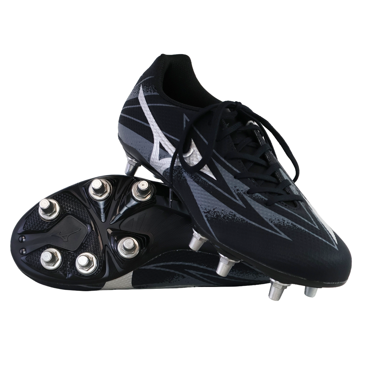 A pair of Mizuno Waitangi Pro SG Wide rugby boots in Black/Galaxy Silver stand displayed: one upright, the other showing its sole and metal soft ground studs.