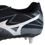 Close-up of the Mizuno Waitangi Pro SG Wide rugby boot in black and galaxy silver, featuring a white Mizuno logo and metal studs for superior soft ground performance.