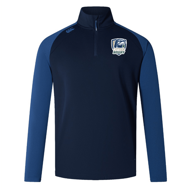 Navy blue CSU Monterey Bay Otter Rugby Elite First Layer VapoDri quarter-zip pullover with light blue sleeves and a logo on the right chest, isolated on a white background by EMB Canterbury.