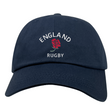 The Nations of Rugby England Dad Cap by EMB S&S Activewear is a navy blue cotton twill cap featuring "ENGLAND RUGBY" and a red rose embroidered on the front—perfect for any fan.