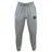 The NOVA RFC Leisure Sweatpant by EMB Canterbury is a pair of grey sustainable sweatpants featuring an elastic waistband and drawstring, adorned with the brand's logo on the left thigh and a Canterbury logo on the right.