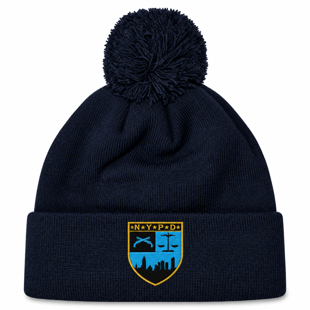 Navy blue cuffed knit New York Police Dept. Rugby Pom Pom Beanie by Canterbury with a pom-pom on top and an NYPD emblem patch on the front.