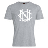 A light gray cotton blend UNC Rugby Club Plain Tee by WRS Canterbury features a large, stylized white monogram on the chest, combining comfort and style for everyday wear.