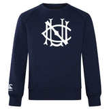 The UNC Rugby Club Crew Sweatshirt by WRS Canterbury is a navy blue crew with a bold white chest logo and a small CCC logo on the lower left sleeve, offering ultra-soft comfort and iconic style.