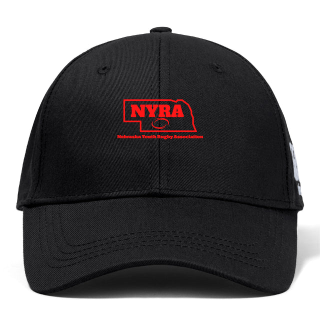 The Nebraska Youth Rugby Association Flexfit Drill Cap by EMB Canterbury is a black cap with a curved brim, featuring an embroidered red Nebraska outline, "NYRA" text, and a rugby ball logo on the front.