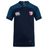 The Naperville Warriors Vapodri Evader Jersey by EMB Canterbury features navy blue and teal colors, a VapoDri moisture-wicking finish, Canterbury logo on the right chest, crest patch on the left chest, and short sleeves.