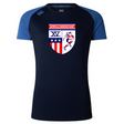 The Naperville Warriors Women's Elite Training Tee by WRS Canterbury features navy Vapodri fabric, lighter blue sleeves, and a chest logo with "Naperville Warriors Rugby" above a shield with stars, stripes, "XV," and a rugby player.
