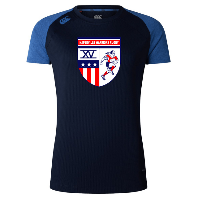 The Naperville Warriors Women's Elite Training Tee by WRS Canterbury features navy Vapodri fabric, lighter blue sleeves, and a chest logo with "Naperville Warriors Rugby" above a shield with stars, stripes, "XV," and a rugby player.
