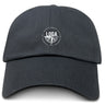 The EMB S&S Activewear League of Gentleman Adventurers Adult Low-Profile Cotton Twill Dad Cap is black with a small, circular white "LOGA" and compass logo embroidered on the front.