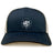 The League of Gentleman Adventurers Retro Trucker Cap by EMB S&S Activewear features a navy blue and beige design with a white "LOGA" logo on the front and an adjustable snapback closure.