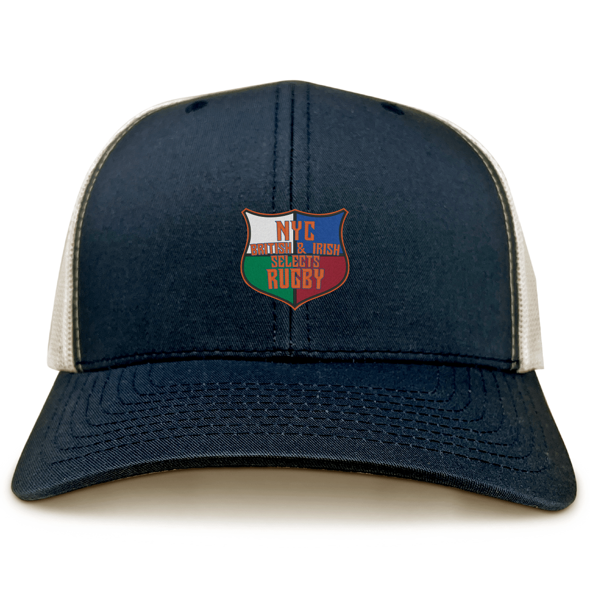 The NYC British and Irish Selects Retro Trucker Cap by EMB S&S Activewear features a navy blue and white design, a comfy polyester-cotton blend, and a shield logo with “NYC Middle & Irish Selects Rugby” in flag colors on the front.