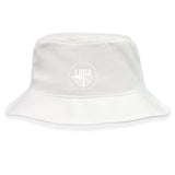 The League of Gentleman Adventurers Crusher Bucket Cap by EMB S&S Activewear features a circular "LOGA" logo and text on the front, offering stylish sun protection in a plain white cotton design.