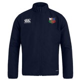 The EMB Canterbury NYC British and Irish Selects Club Track Jacket is a lightweight, navy blue sports jacket with a logo on the right chest above "MORGAN ACADEMY RUGBY." This versatile track jacket is water-repellent, perfect for all weather conditions.