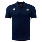 The League of Gentleman Adventurers Club Dry Polo by EMB Canterbury is a navy blue short-sleeve polo with a collar, CCC logo on the right chest, "LOGA" emblem on the left, and Vapodri Technology for cool, breathable comfort.