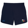 The NYC British and Irish Selects Elite Woven Short by EMB Canterbury in navy blue features the Canterbury logo on the left and a multicolored rugby club emblem on the right, perfect for elevating your training sessions.
