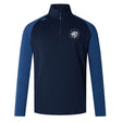 The League of Gentleman Adventurers Elite First Layer by EMB Canterbury is a navy and blue long-sleeve quarter-zip rugby training top with VapoDri technology, a white LOGA logo on the left chest, and a Canterbury logo on the right shoulder.