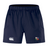 The NYC British and Irish Selects Advantage Short 2.0 by Canterbury, in navy blue, features a white embroidered logo on the right and a colorful emblem on the left. Designed for performance and sustainability by EMB Canterbury, they provide style and function for any athletic endeavor.