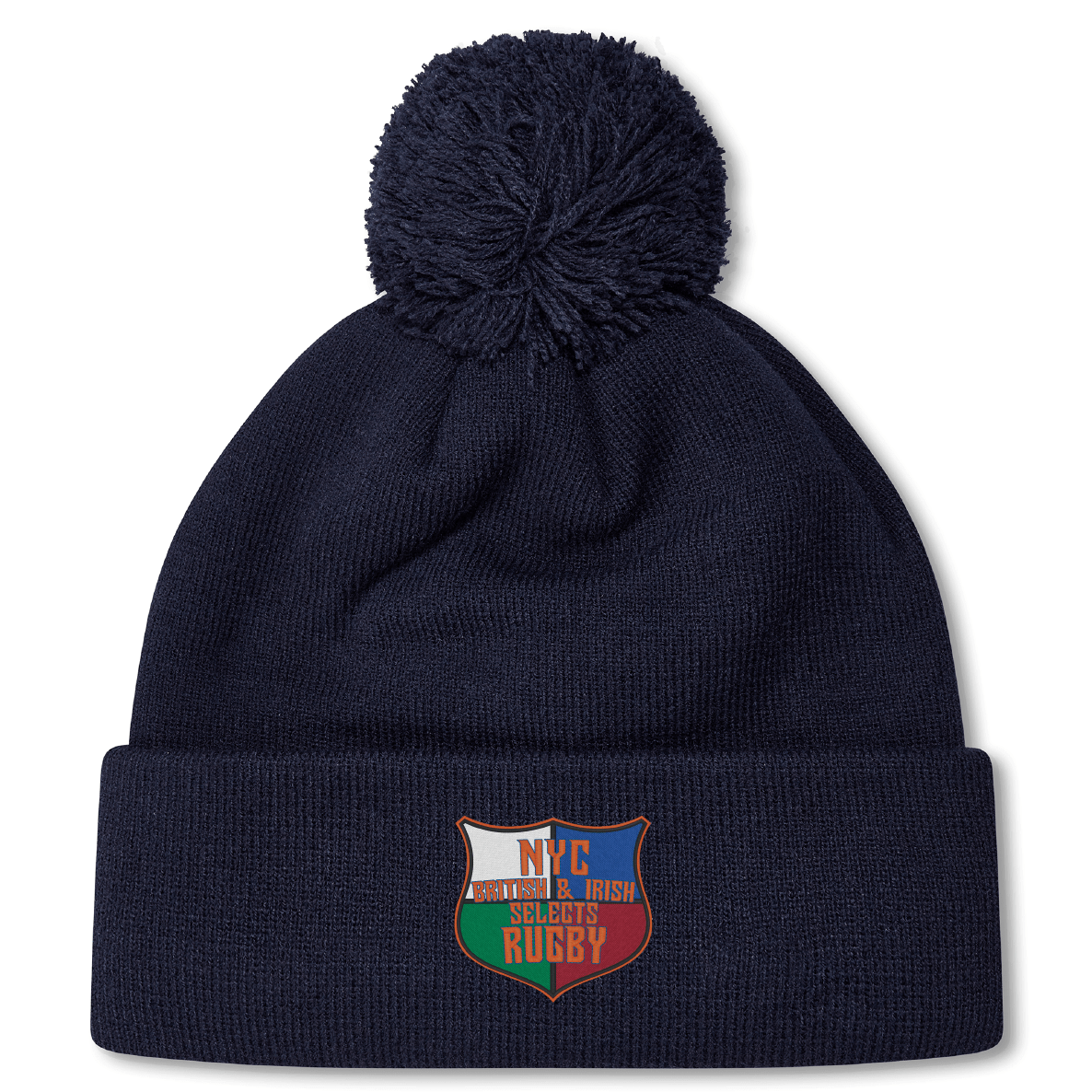 The NYC British and Irish Selects Pom Pom Beanie by EMB Canterbury is a stylish navy blue fleece-lined hat with a pom-pom, featuring an embroidered patch displaying a shield design and the text "NYC American & Irish Stouts Rugby.